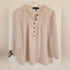 Light pink and black polkadot semi-sheer blouse.